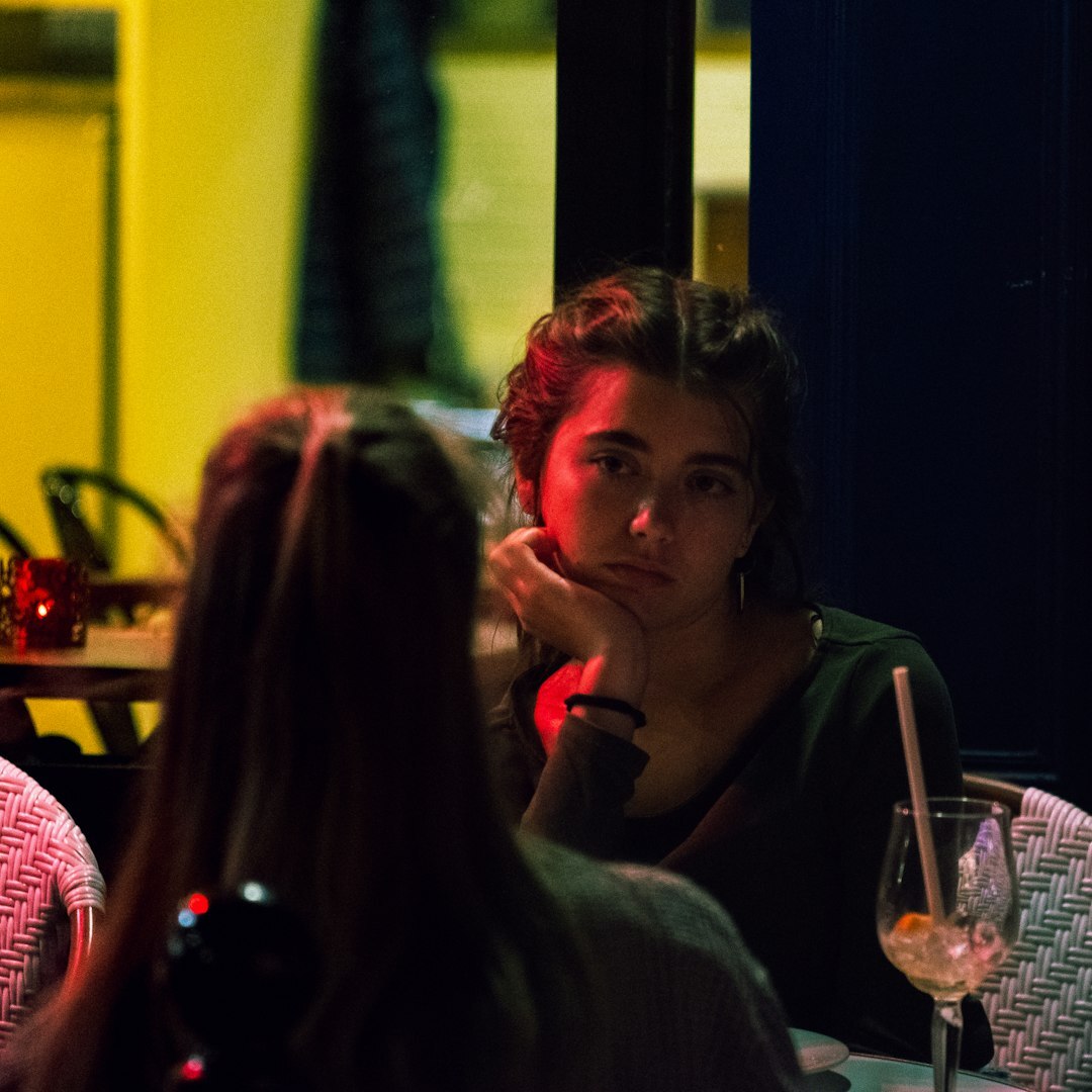 Small diverse group of young Brazilian adults talking and laughing together