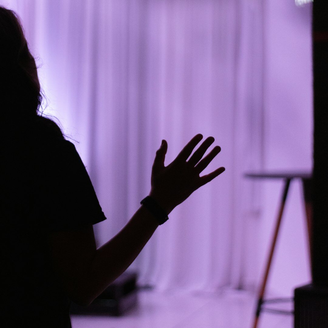 Woman speaking confidently to an audience at an event
