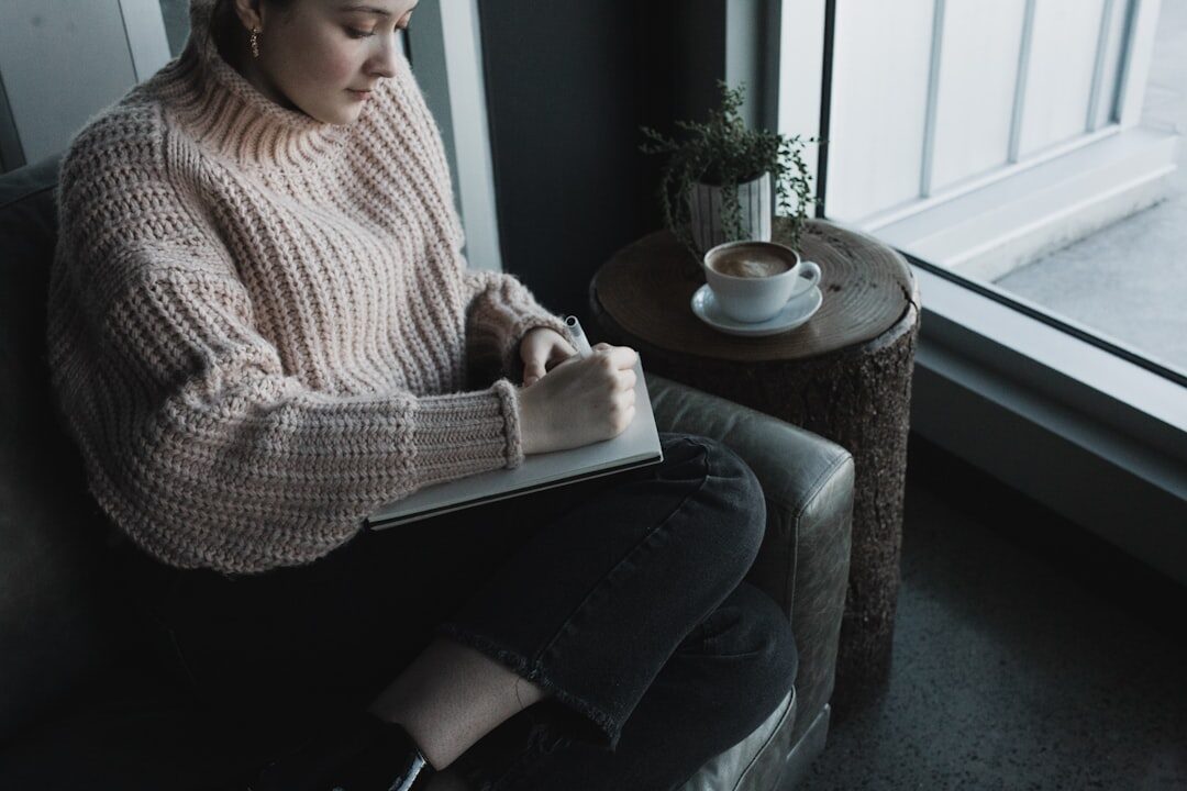 woman writing in journal