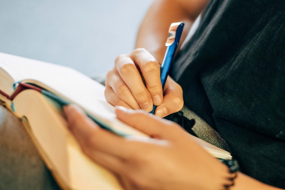 person writing notes