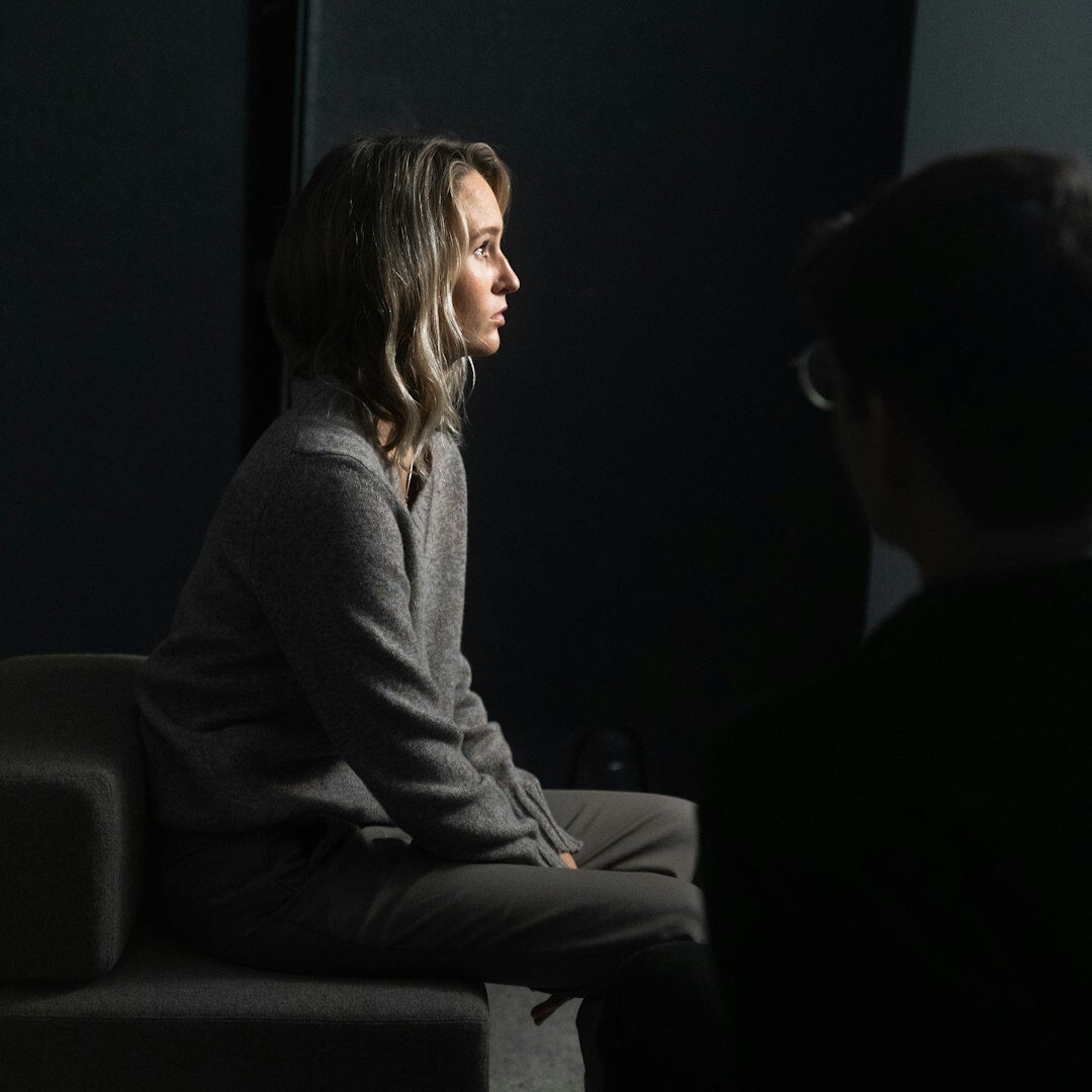Facilitator speaking to a seated group during a workshop
